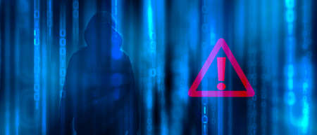 Ransomware concept. Abstract digital background with anonymous man hacker in binary code with warning sign. Hack, darkness, virtual reality and science fiction. Matrix background with cybersecurityの写真素材