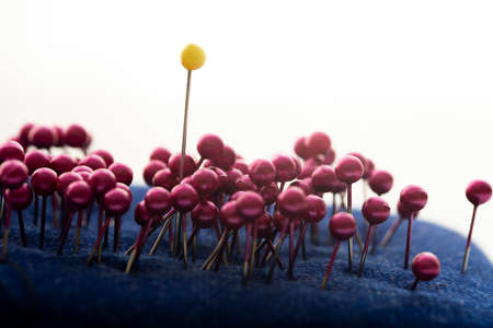Yellow pin in the middle. Outstanding, choice and difference concept. Being unique and individualityの写真素材