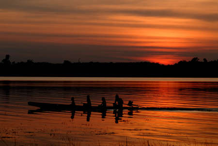 Boat sunset at Bung Khong Long in Thailandの写真素材
