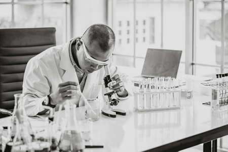Asian male  scientist doing the lab in the aquatic laboratory with the blurred background