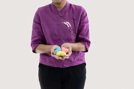Woman hold 3 colorful handicraft heart in her hand isolated with white background and copy space fore textの写真素材
