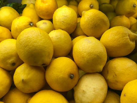 Lemons top view with zoom sale in the fresh vegetable zone on the shelf in supermarketの写真素材