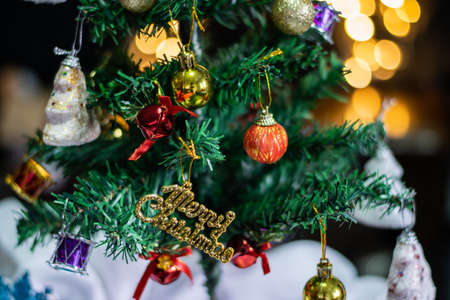 Decorated christmas tree with the bokeh background of round lightの写真素材