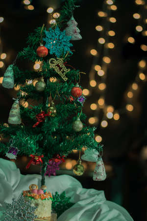 Decorated christmas tree with the bokeh background of round lightの写真素材