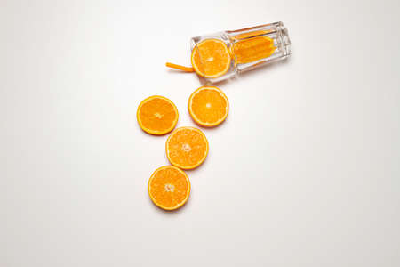 hand chopping a orange in a chop-board and squeezer