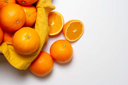 hand chopping a orange in a chop-board and squeezerの写真素材