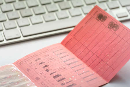 Inside a french driver licence and white keyboardの写真素材