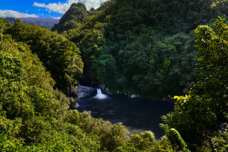 Waterfall of Bassin La Mer at Reunion Island during a sunny dayの写真素材