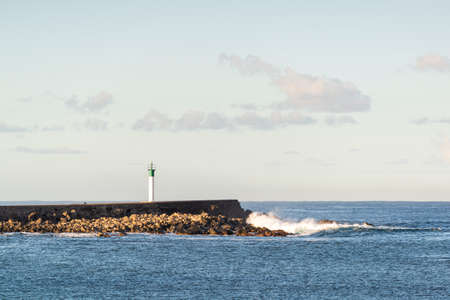 Jetty at Terre Sainte village at Reunion Island during a sunny dayの写真素材