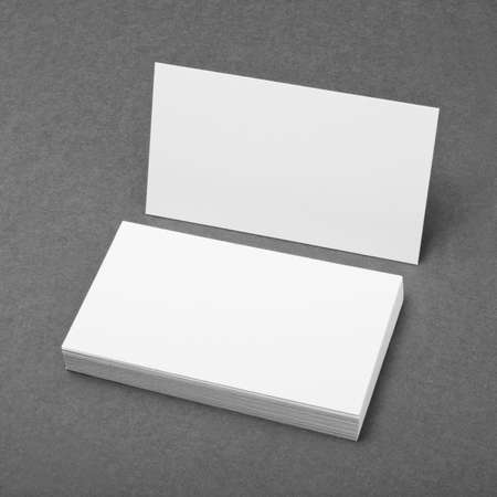 blank business cards on grey background