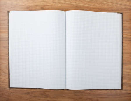 Blank squared notebook sheets on a table