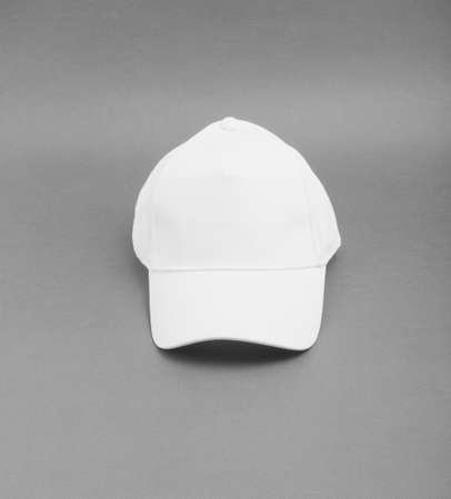 White baseball cap on gray backgroundの写真素材