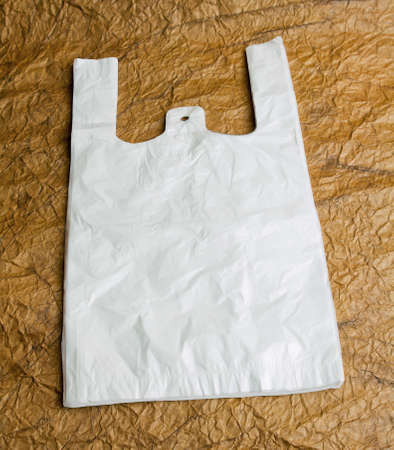 White bags with handle on brown design paperの写真素材