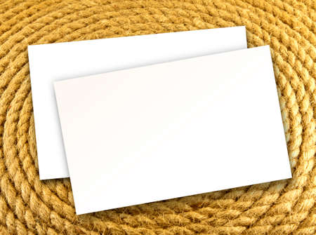 Blanks white business cards on a rope backgroundの写真素材