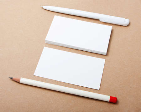 blank business card with pen and pencil on crafts background,  identity design, corporate templates, company styleの写真素材