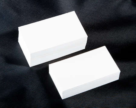 blank business cards on a black background