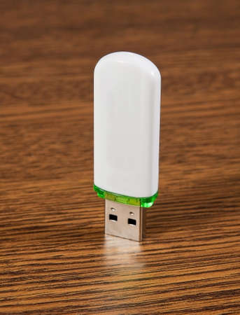 USB Flash Drive on a wooden background