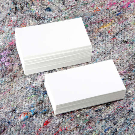 blank business cards on a fabric texture background