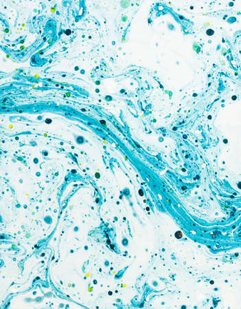Abstract blue swirl background made from a can of paint