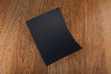 Blank flyer poster on wood to replace your designの写真素材