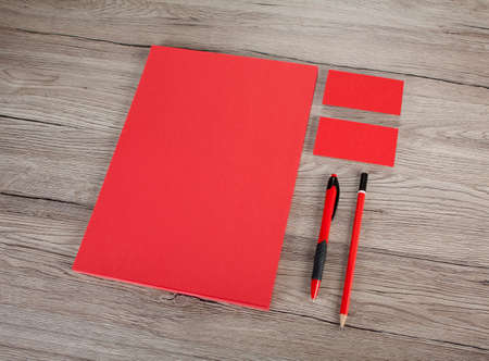 Blank Stationery on wooden background. Consist of Business cards, A4 letterheads, pen and pencilの写真素材