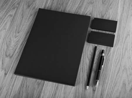 Blank Stationery on wooden background. Consist of Business cards, A4 letterheads, pen and pencil