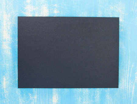 Blank flyer poster on wooden background to replace your designの写真素材