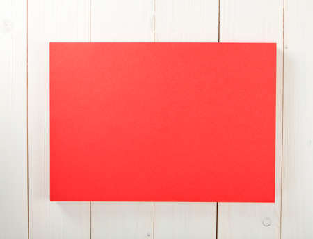 Blank flyer poster on wooden background to replace your design