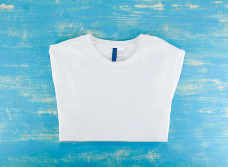 White t-shirt template on a blue wooden backgroundの写真素材