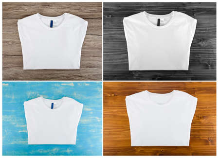 Set of white folded t-shirt template on a wooden backgroundの写真素材