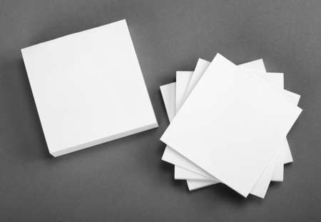 Collection of white note papers on gray backgroundの写真素材