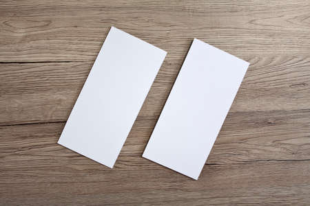 Blank flyer over wooden background to replace your design
