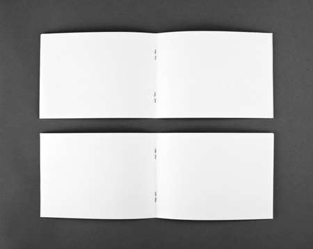 Blank opened magazine isolated on grey background, top view