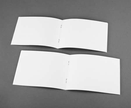 Blank opened magazine isolated on grey background, top viewの写真素材