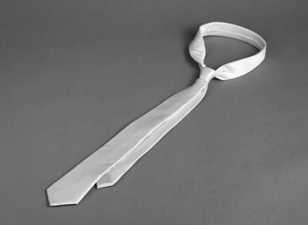Beige mens necktie on a grey backgroundの写真素材