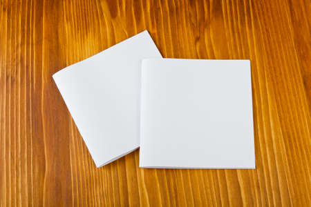 Blank catalog, brochure, book mock up. Empty opened magazine on wooden background