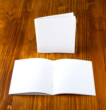 Blank catalog, brochure, book mock up. Empty magazine on wooden background