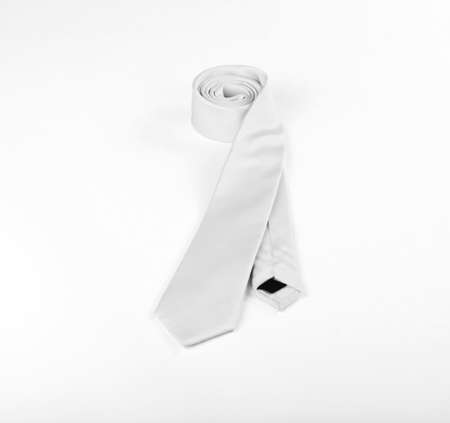 White necktie on white background, roll of necktie on white background. A White tie on white backgroundの写真素材