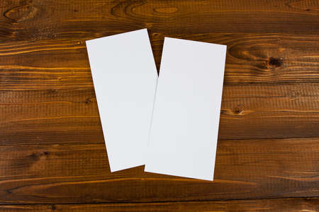 Blank paper over wooden background to replace your design