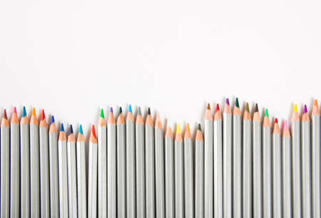 Many different color pencils on white background