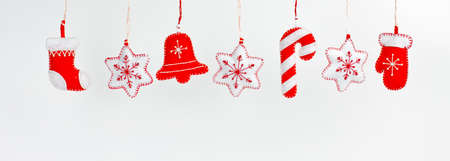 Hanging Christmas and New Year decorations on a white backgroundの写真素材