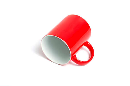 Red and white coffee cup mockup lying on white backgroundの写真素材