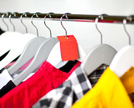 Black Friday shopping sale concept. Sale in a clothing store - discount sign at a clothes rackの写真素材