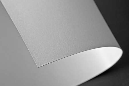 Curled corner of white paper. Mock up. Close up. Macro shotの写真素材