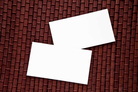 Blank business cards on a bamboo mat, identity design, corporate templates, company style