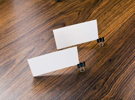 Mockup of white business cards at wooden background. Template for branding identity