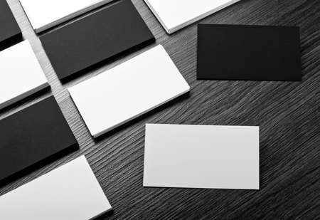 Mockup of white and black business cards at wooden background. Template for branding identity