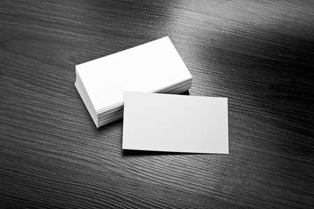 Mockup of white business cards at wooden background. Template for branding identity