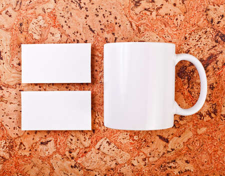 Mockup of white business cards at a cork background. Template for branding identityの写真素材