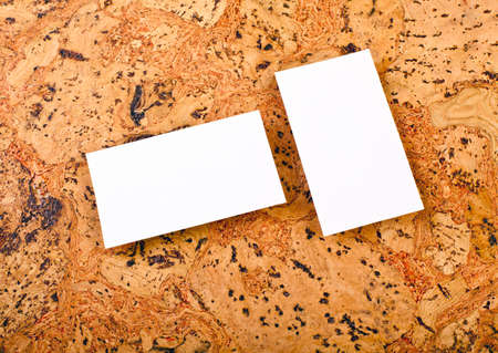 Mockup of white business cards at a cork background. Template for branding identityの写真素材